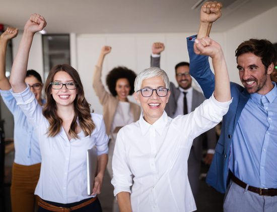 happy-business-people-celebrating-success-at-compa-5FUVHK4.jpg